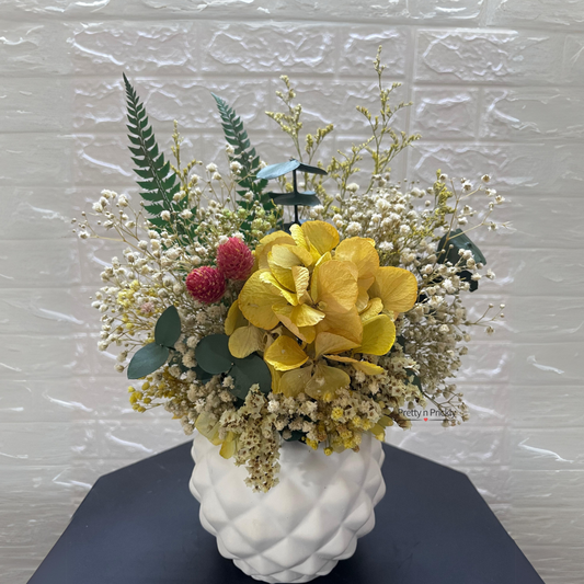 Mellow Yellow: Dried and preserved potted flower arrangement